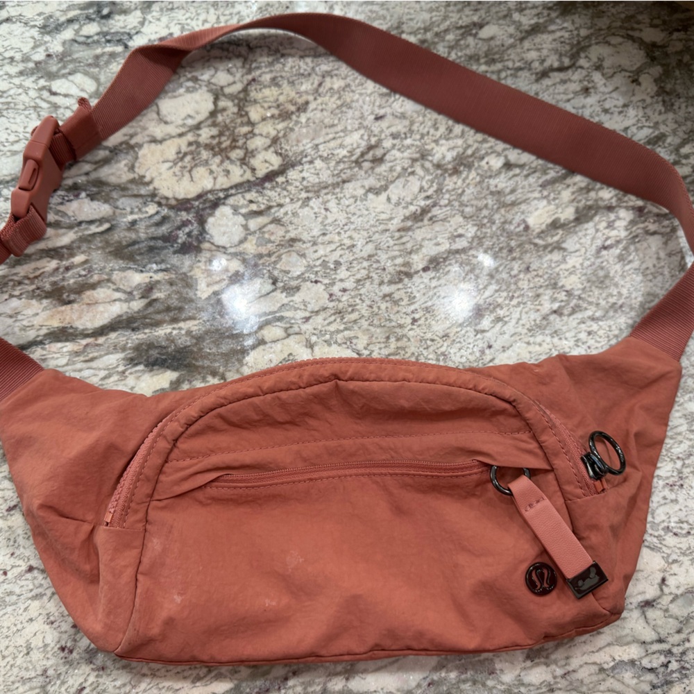 Lululemon crossbody On The Beat bag. Beautifully burnt orange color.